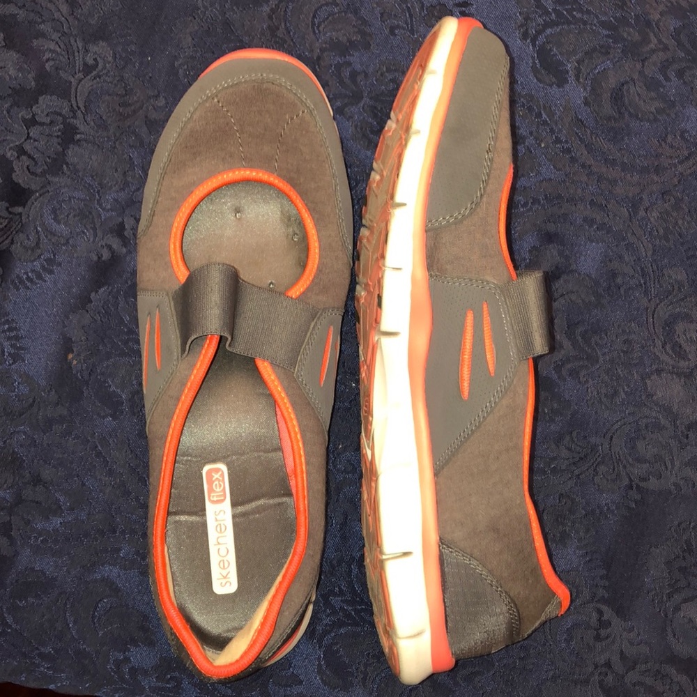 Pink and gray Sketchers flex walking shoes.